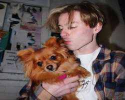 He loves to hug and play with his dog.